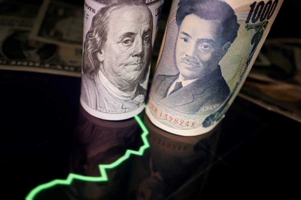 Japanese yen and U.S. dollar banknotes with a currency exchange rate graph, on June 16, 2022. (Florence Lo/Illustration/Reuters)
