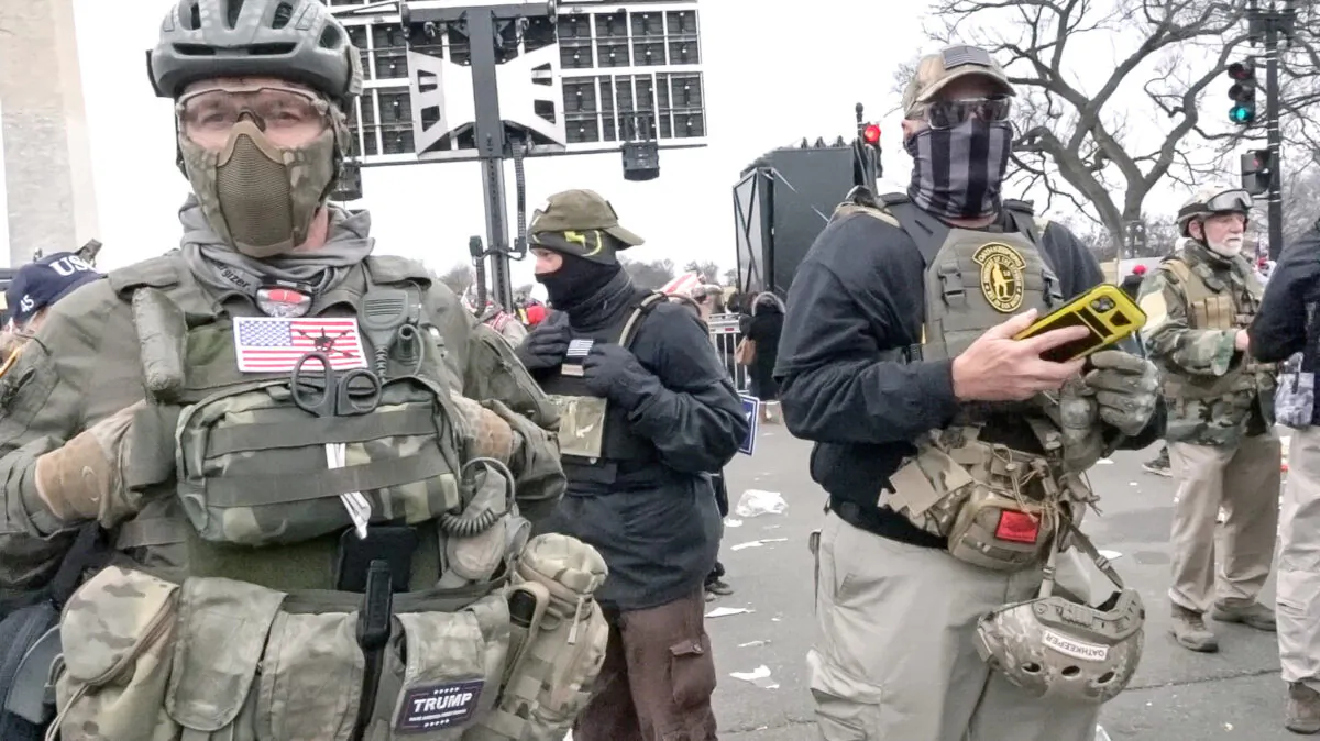 Members of the Oath Keepers walk from President Donald Trump's speech to the U.S. Capitol on Jan. 6, 2021. (Luke Coffee/Screenshot via The Epoch Times)