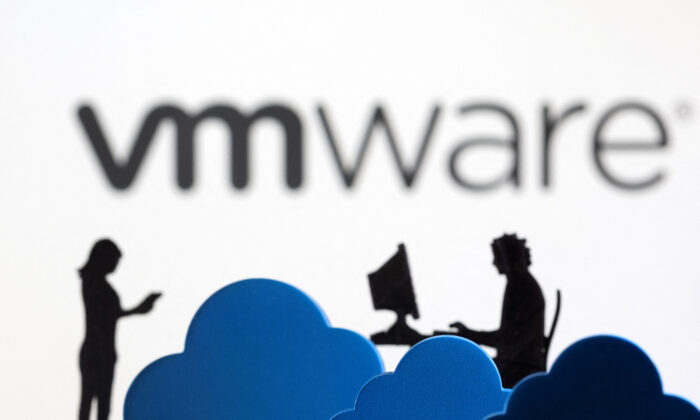 3D printed clouds and figurines in front of the VMware cloud service logo in a photo illustration taken on Feb. 8, 2022. (Dado Ruvic/Illustration/Reuters)