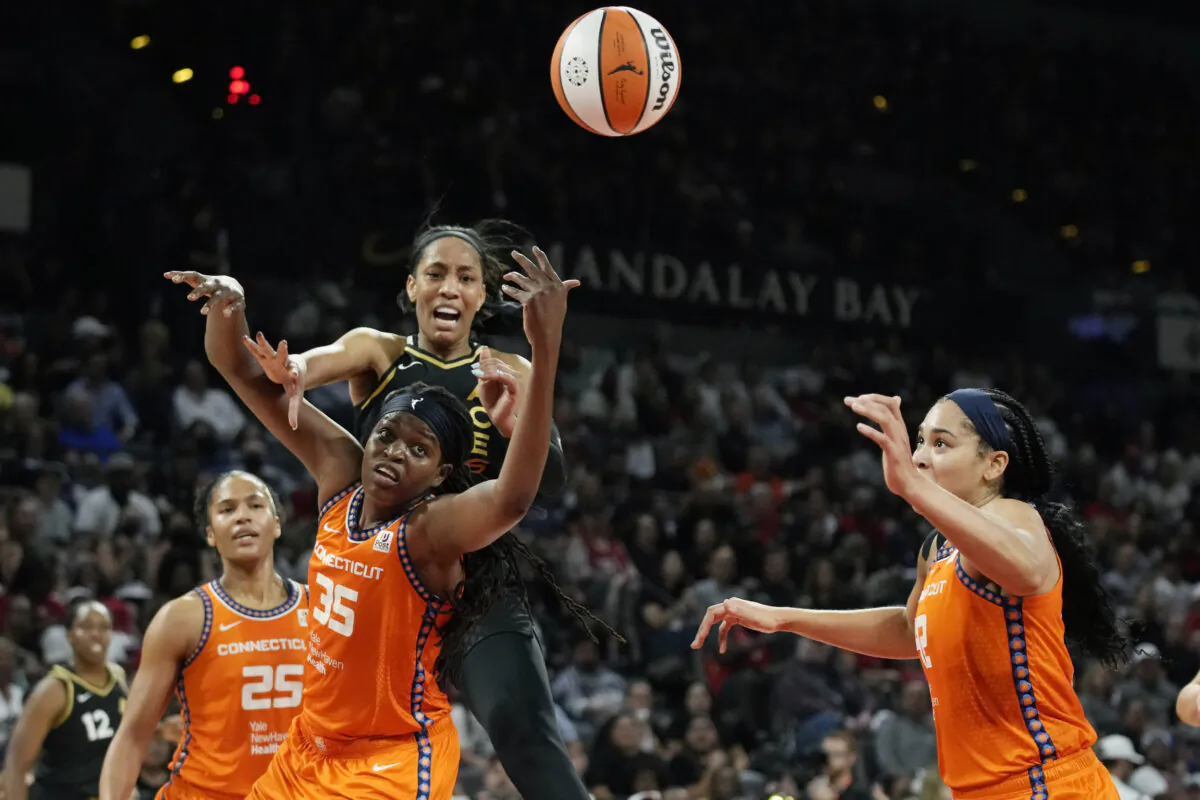 Connecticut Sun forward Jonquel Jones (35) battles of the ball with Las Vegas Aces forward A'ja Wilson (22) during the first half in Game 2 of a WNBA basketball final playoff series in Las Vegas, Sept. 13, 2022. (John Locher/AP Photo)