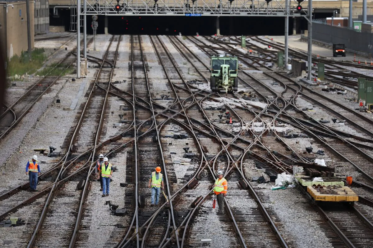 Workers service the tracks at the Metra/BNSF railroad yard outside of downtown Chicago, on Sept. 13, 2022. (Scott Olson/Getty Images)