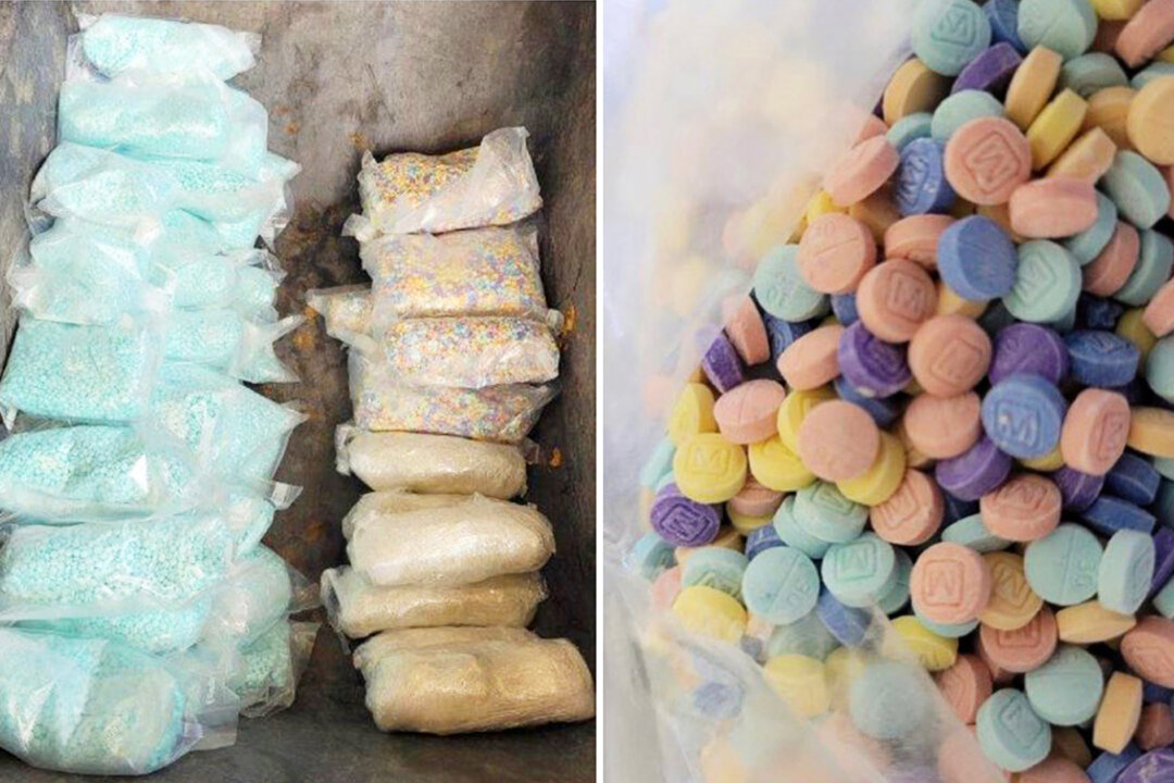 U.S. Customs and Border Protection seized approximately 47,000 rainbow-colored fentanyl pills, 186,000 blue fentanyl pills, and 6.5 pounds of meth hidden in a floor compartment of a vehicle at the Nogales port of entry on the southern border with Mexico on Sept. 3, 2022. (U.S. Customs and Border Protection)
