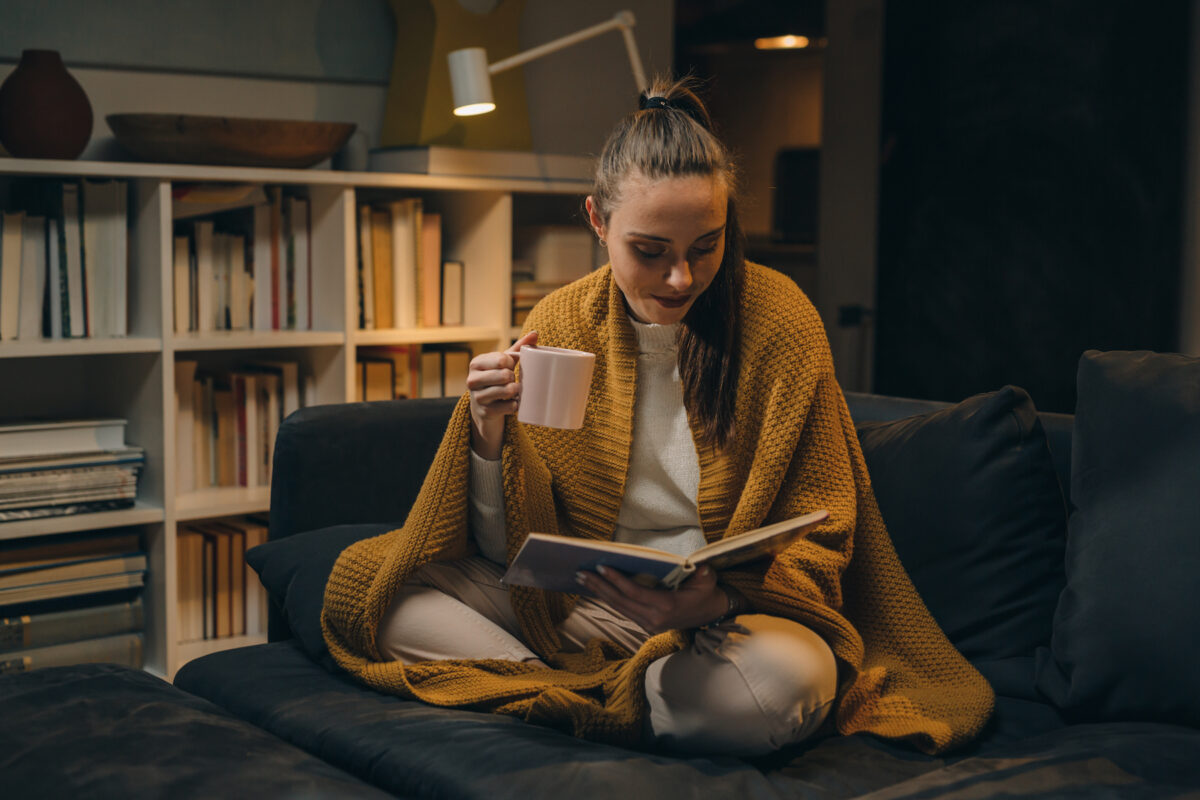 Wind down in the evening by reading, journaling, or meditating. (Dejan Dundjerski/Shutterstock)