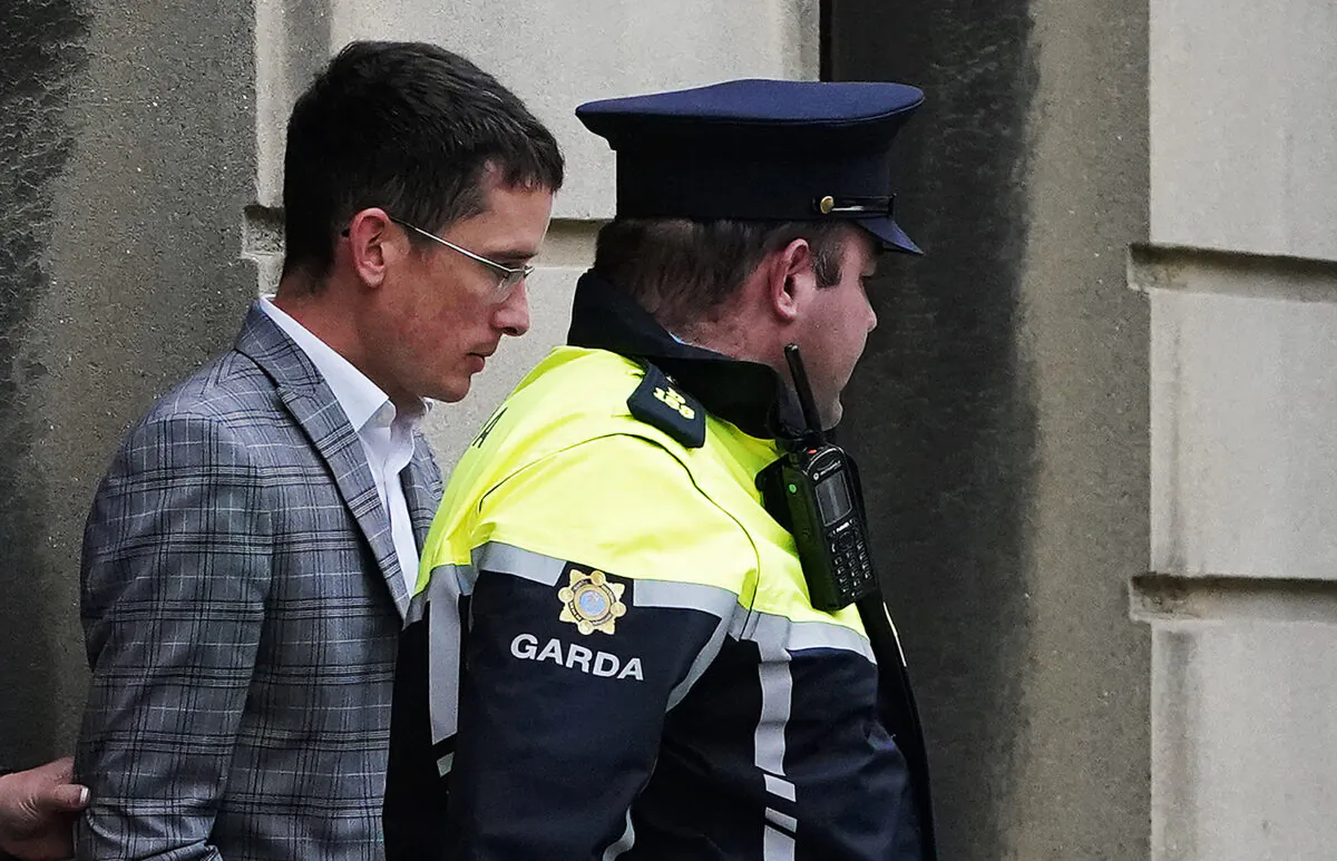Irish schoolteacher Enoch Burke (L) leaves the High Court in Dublin to return to Mountjoy Prison on Sept. 14, 2022. (Brian Lawless/PA Wire/PA Images)