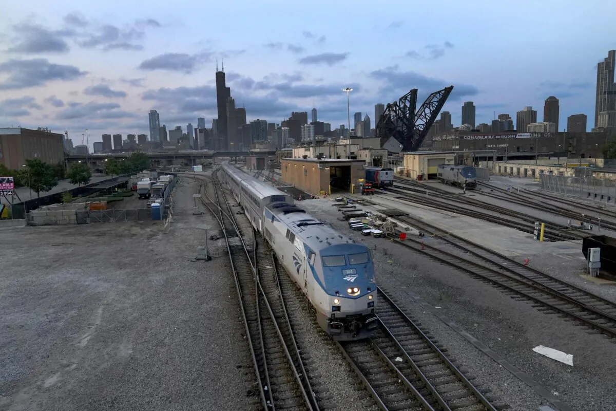An Amtrak passenger train departs Chicago in the early evening headed south in Chicago on Sept. 14, 2022. (Charles Rex Arbogast/AP Photo)
