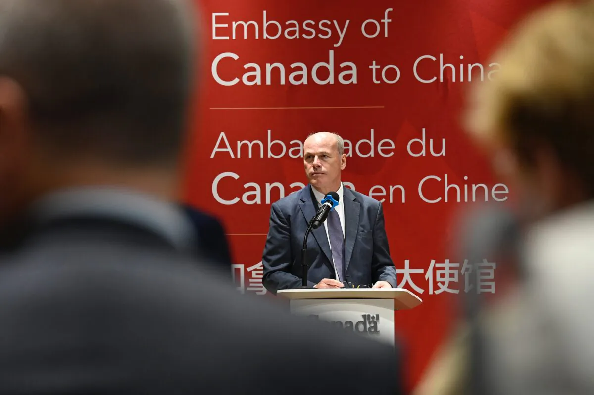 Deputy chief of Mission of Canadian embassy Jim Nickel speaks to journalists and diplomats at the Canadian Embassy in Beijing on Aug. 11, 2021. (Jade Gao/AFP via Getty Images)