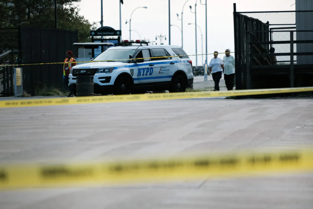 Police work along a stretch of beach at Coney Island which is now a crime scene after a mother is suspected of drowning her children in the ocean, in the Brooklyn borough of New York City, on Sept. 12, 2022. (Spencer Platt/Getty Images)