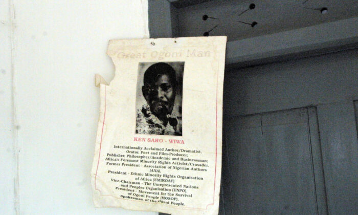 A poster showing late Ogoni human rights activists Ken Saro-Wiwa hangs at his father's sitting room at Bane town, Nigeria, on Nov. 19, 2003. (Pius Utomi Ekpei/AFP via Getty Images)