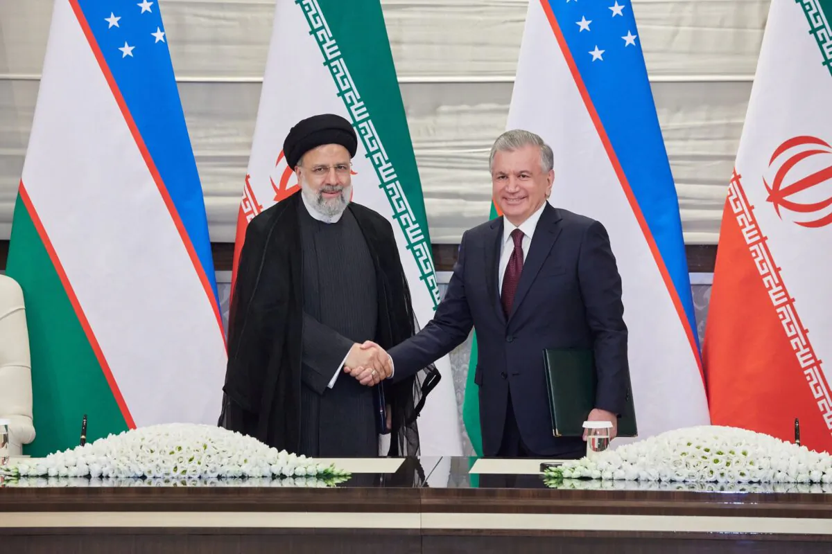 Uzbekistan's President Shavkat Mirziyoyev (R) meets Iran's counterpart Ebrahim Raisi ahead of the Shanghai Cooperation Organization (SCO) summit in Samarkand, Uzbekistan on Sept. 14, 2022. (Foreign Ministry of Uzbekistan/Handout via Reuters)