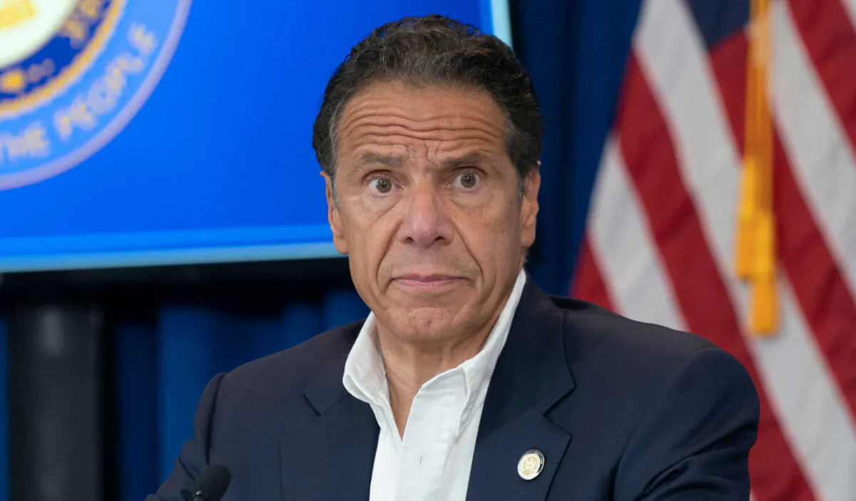 Then-New York Gov. Andrew Cuomo makes an announcement and holds media briefing at Port Authority Administration building at JFK, in New York, N.Y., on July 20, 2020. (lev radin/Shutterstock)