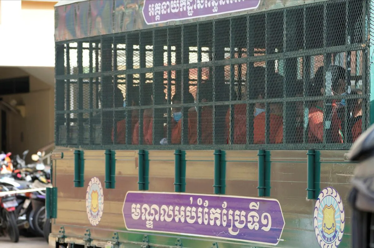 People on a prison truck arrive at the Phnom Penh Municipal Court in Phnom Penh, Cambodia, on Sept. 15, 2022. (Heng Sinith/AP Photo)
