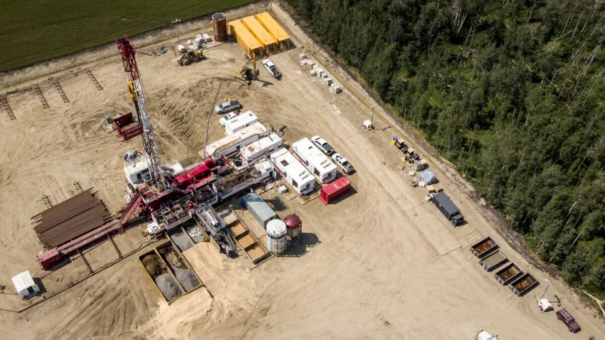 An oil drilling rig operates in a field near Cremona, Alta., on July 12, 2021. (The Canadian Press/Jeff McIntosh)