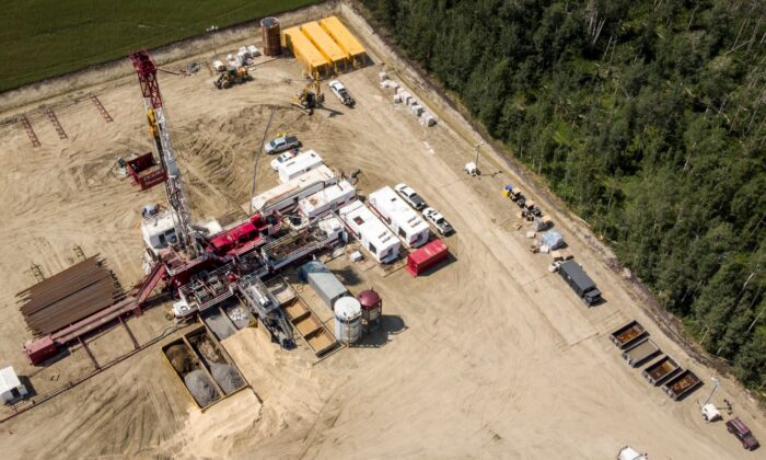 An oil drilling rig operates in a field near Cremona, Alta., on July 12, 2021. (The Canadian Press/Jeff McIntosh)