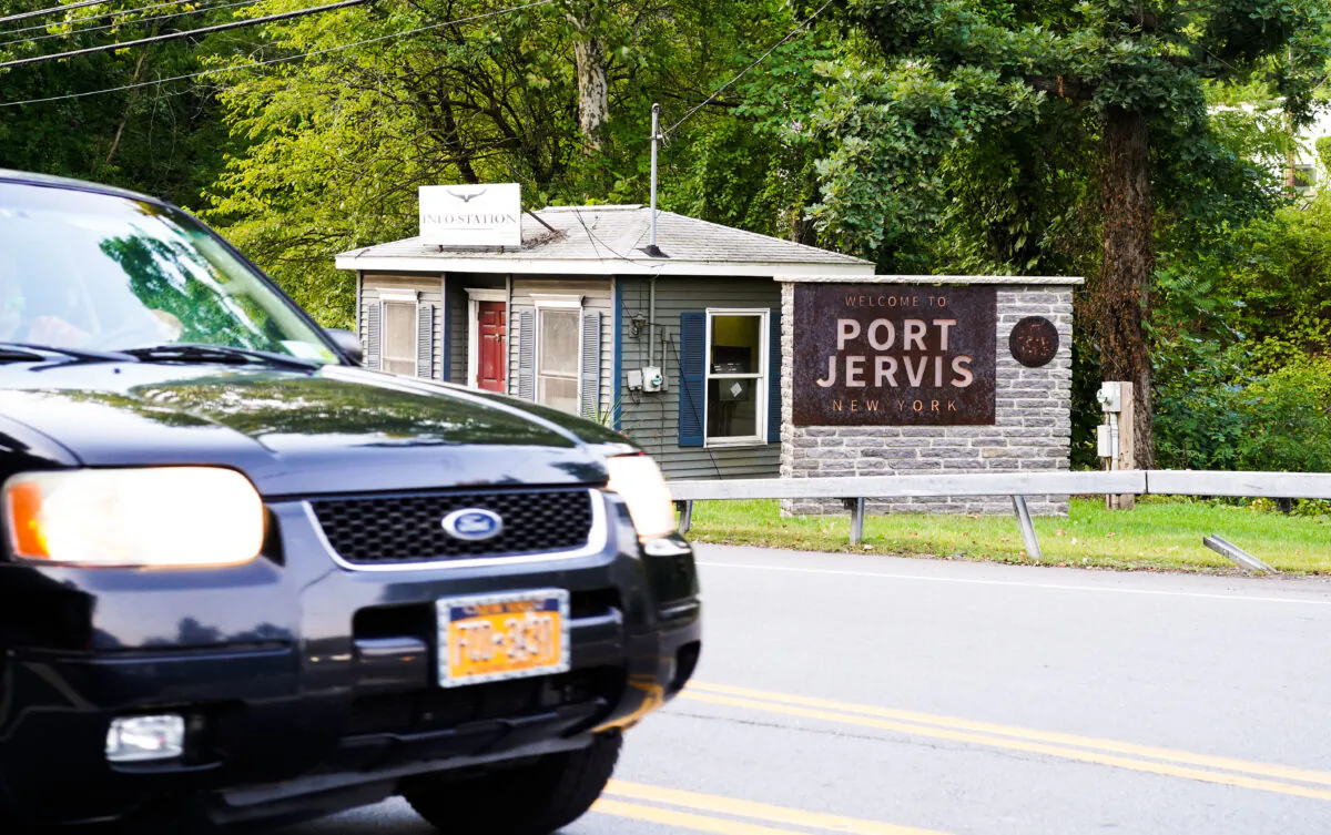 A sign that welcomes people to the city of Port Jervis sits off an exit from Interstate Highway 84 in Orange County, N.Y., on Sept. 9, 2022. (Cara Ding/The Epoch Times)