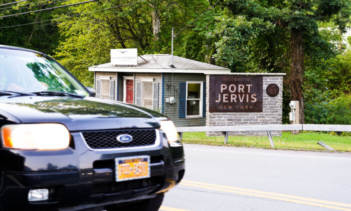 A sign that welcomes people to the city of Port Jervis sits off an exit from Interstate Highway 84 in Orange County, N.Y., on Sept. 9, 2022. (Cara Ding/The Epoch Times)