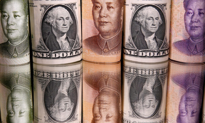 Chinese Yuan and U.S. dollar banknotes on Feb. 10, 2020. (Dado Ruvic/Illustration/Reuters)