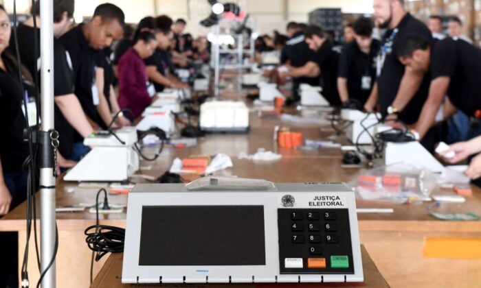 Electoral Court officials prepare electronic voting machines for Brazil's general election, in Brasilia on Sept. 19, 2018. (Evaristo Sa/AFP via Getty Images)