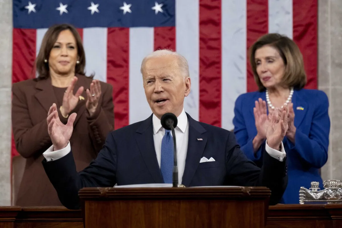 President Joe Biden arrives to deliver the State of the Union address as Vice President Kamala Harris (L) and House Speaker Nancy Pelosi (D-Calif.) look on during a joint session of Congress in the U.S. Capitol House Chamber in Washington on March 1, 2022. (Saul Loeb/Pool/Getty Images)