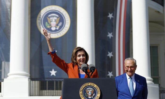 House Speaker Nancy Pelosi (D-Calif.) delivers remarks alongside Senate Majority Leader Chuck Schumer (D-N.Y.) at an event celebrating the passage of the Inflation Reduction Act on the South Lawn of the White House in Washington on Sept. 13, 2022. (Anna Moneymaker/Getty Images)