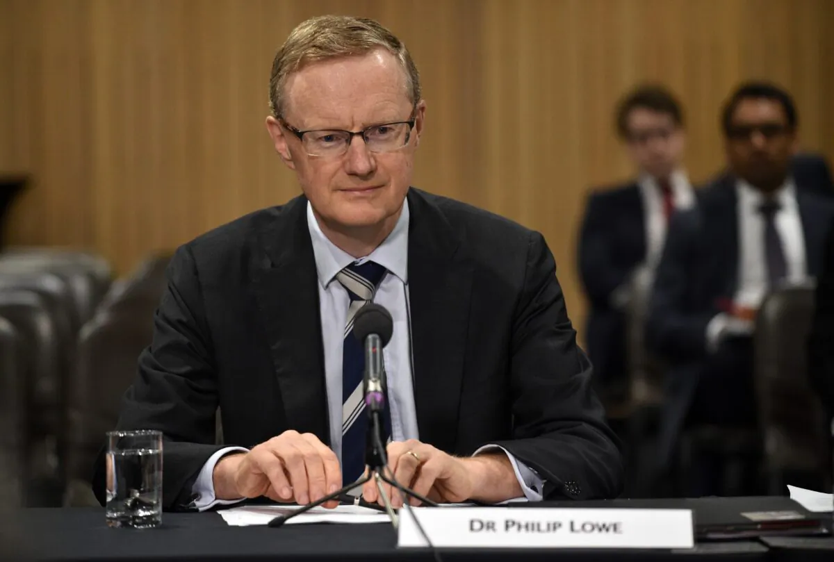 Reserve Bank of Australia Governor Philip Lowe sits at a table for a parliamentary economics committee hearing in Sydney, Australia, on Sept. 22, 2016.
(Peter Parks/AFP via Getty Images)