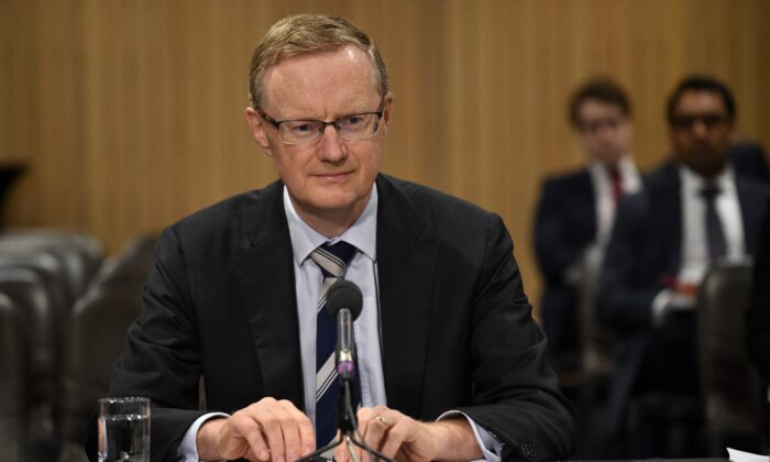 Reserve Bank of Australia Governor Philip Lowe sits at a table for a parliamentary economics committee hearing in Sydney, Australia, on Sept. 22, 2016.
(Peter Parks/AFP via Getty Images)