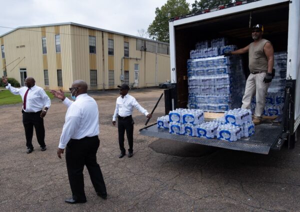 church members help water distribution