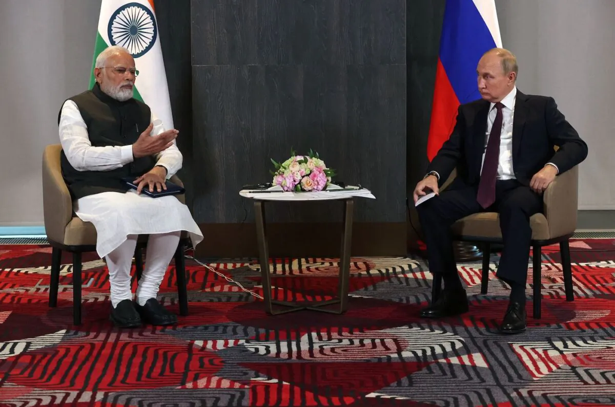 Russian President Vladimir Putin (R) meets with India's Prime Minister Narendra Modi on the sidelines of the Shanghai Cooperation Organisation (SCO) leaders' summit in Samarkand, Uzbekistan, on Sept. 16, 2022. (Sergei Bobylyov/Sputnik/AFP via Getty Images)