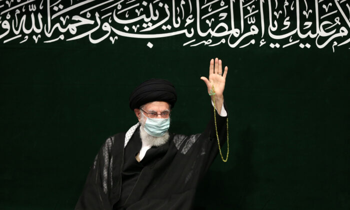 Iranian Supreme Leader Ayatollah Ali Khamenei waves to his well-wishers during a religious ceremony in Tehran, Iran, on Sept. 17, 2022. (Office of the Iranian Supreme Leader via AP)