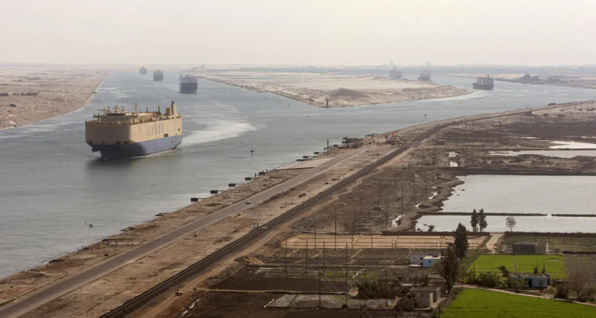Cargo ships navigate in the Suez Canal between Port Said and Ismailia on Nov. 24, 2008. (Cris Bouroncle/AFP via Getty Images)