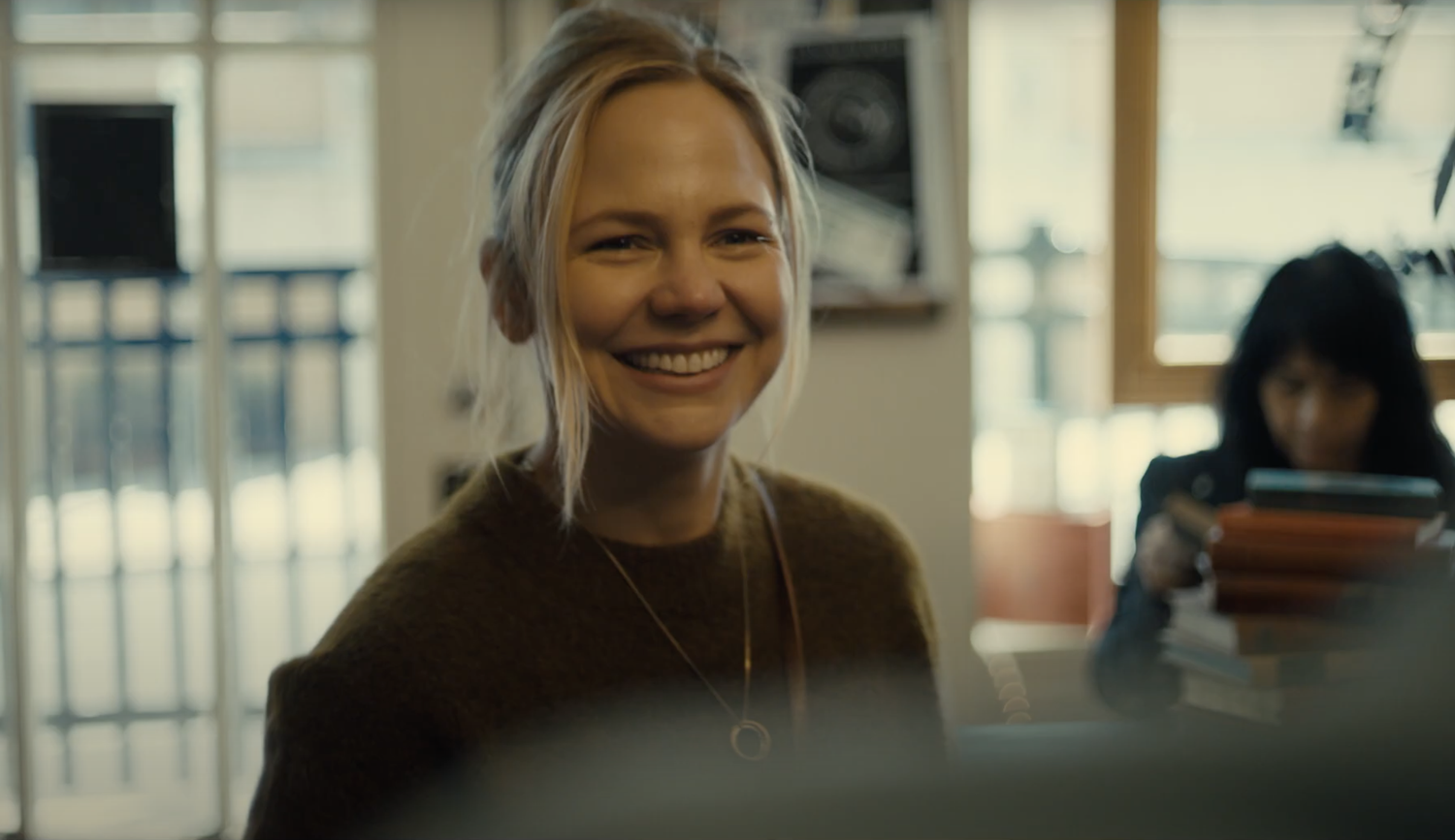 blond woman in foreground in THE SWEARING JAR