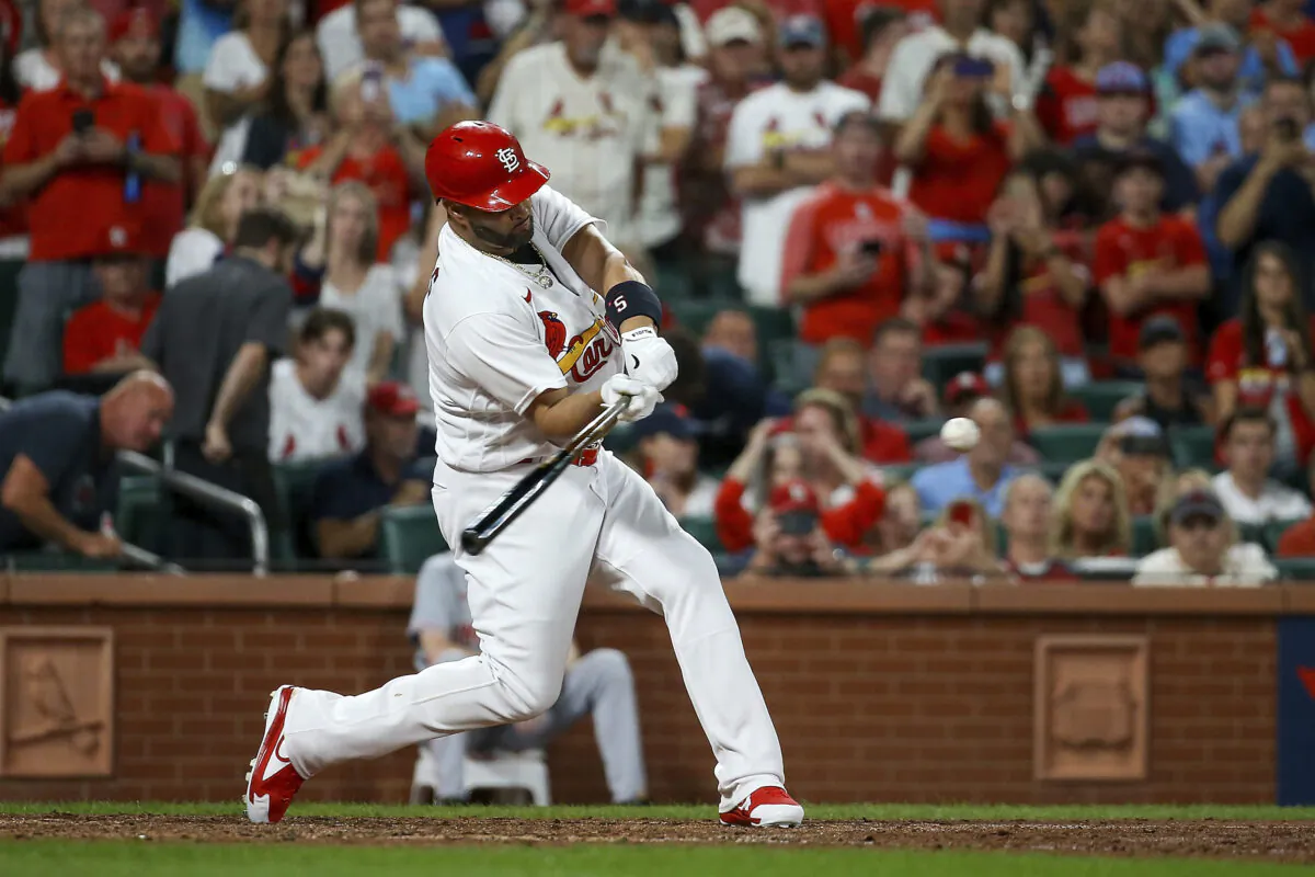 St. Louis Cardinals' Albert Pujols hits a two-run home run during the sixth inning of a baseball game against the Cincinnati Reds in St. Louis, on Sept. 16, 2022. (Scott Kane/AP Photo)