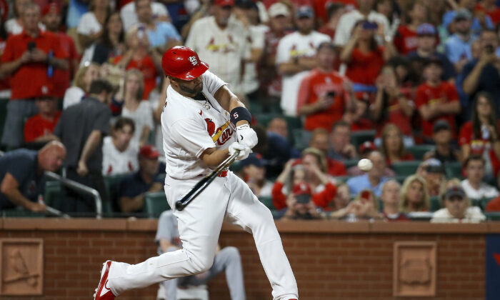 St. Louis Cardinals' Albert Pujols hits a two-run home run during the sixth inning of a baseball game against the Cincinnati Reds in St. Louis, on  Sept. 16, 2022. (Scott Kane/AP Photo)