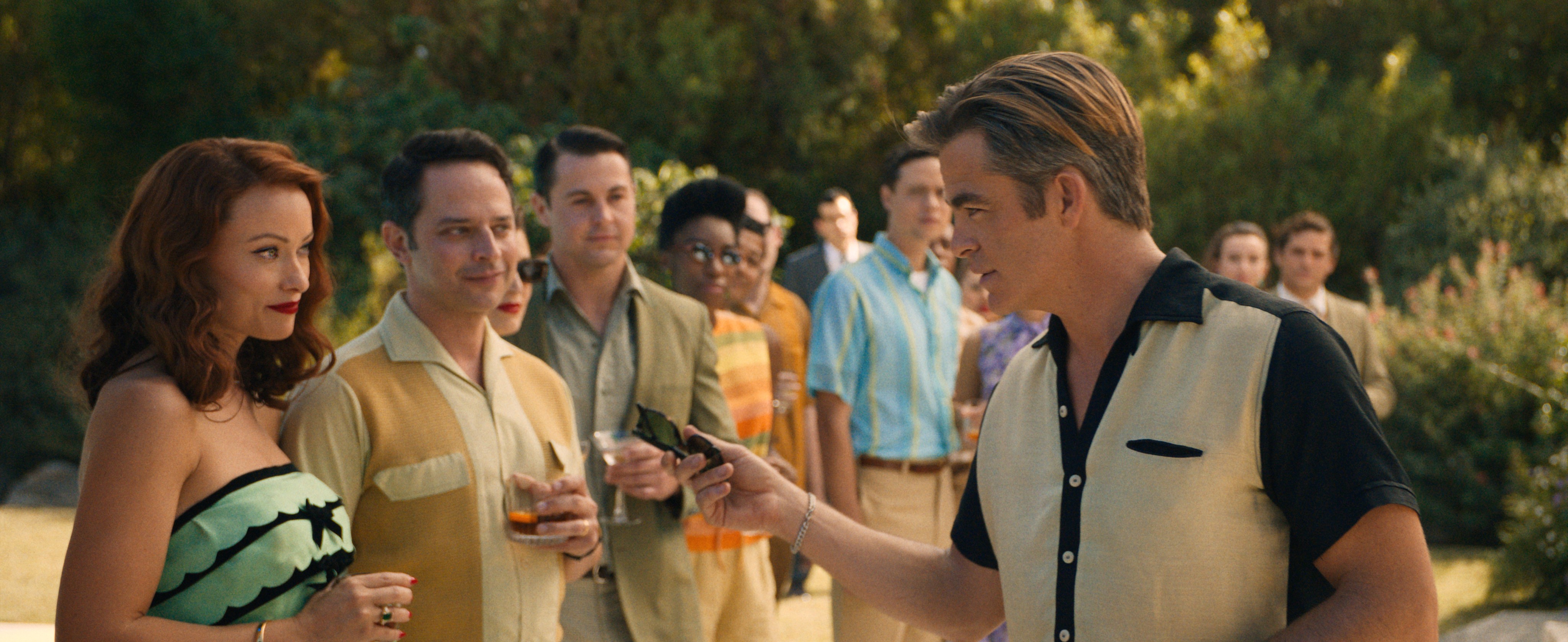 group of people at a party in DON'T WORRY DARLING