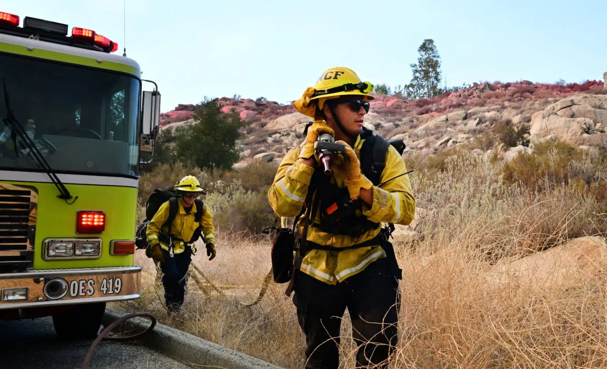 Firefighters work under excessive heat conditions putting out the Fairview Fire in Hemet, Calif., on Sept. 6, 2022. (Frederic J. Brown/AFP via Getty Images)