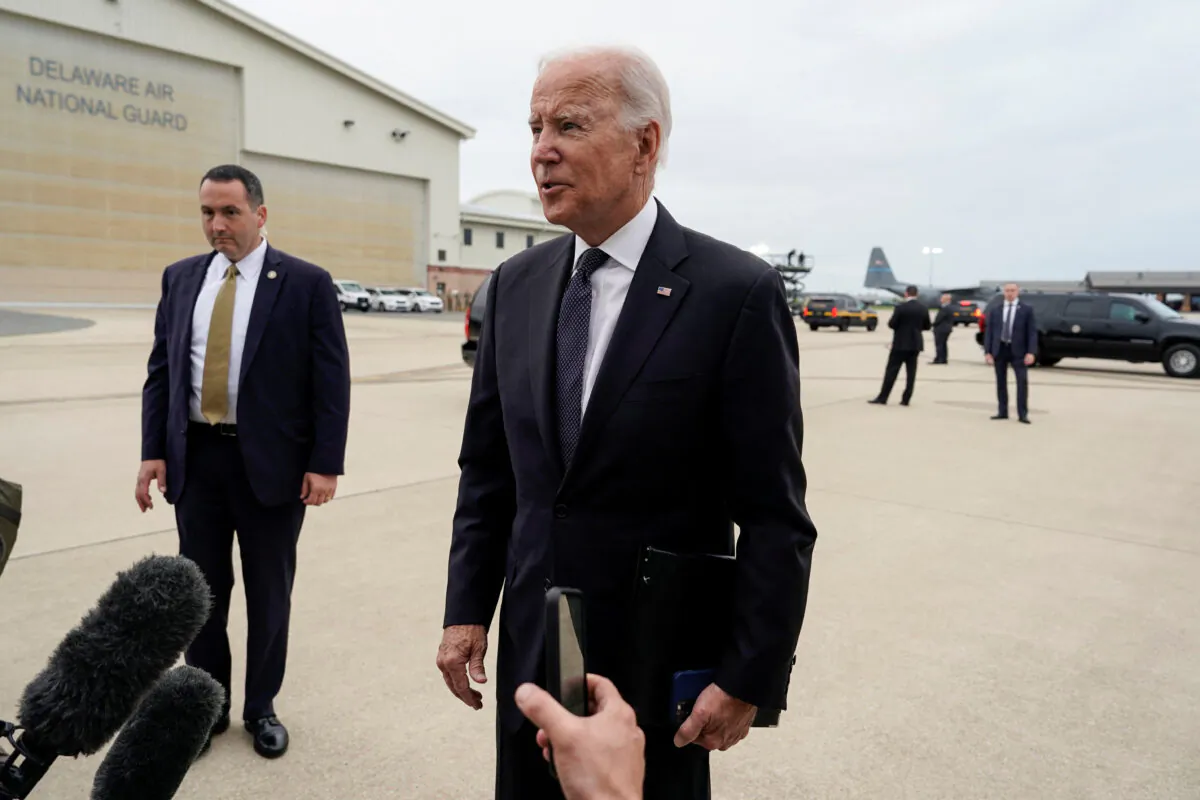 President Joe Biden speaks to media before boarding Air Force One as he departs for Washington from New Castle, Del., on Sept. 11, 2022. (Joshua Roberts/Reuters)
