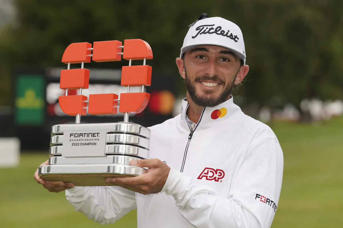 Max Homa poses with his trophy on the 18th green of the Silverado Resort North Course after winning the Fortinet Championship PGA golf tournament Max Homa knew he had no choice but to go for it on the par-5 18th hole if he wanted to defend his title at the Fortinet Championship in Napa, Calif., on  Sept. 18, 2022. (Eric Risberg/AP Photo)