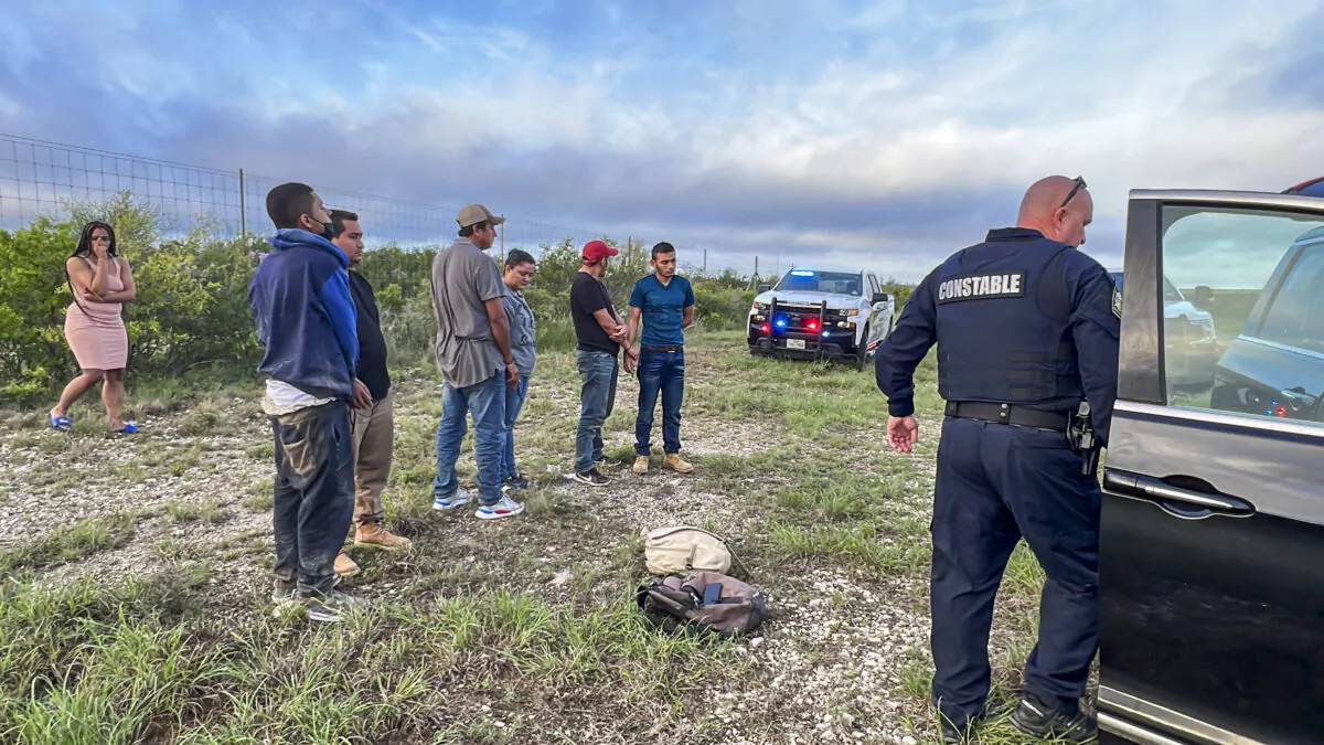Galveston constables apprehend six illegal aliens who were being smuggled from the U.S.–Mexico border, through Kinney County, Texas, on Aug. 28, 2022. (Charlotte Cuthbertson/The Epoch Times)
