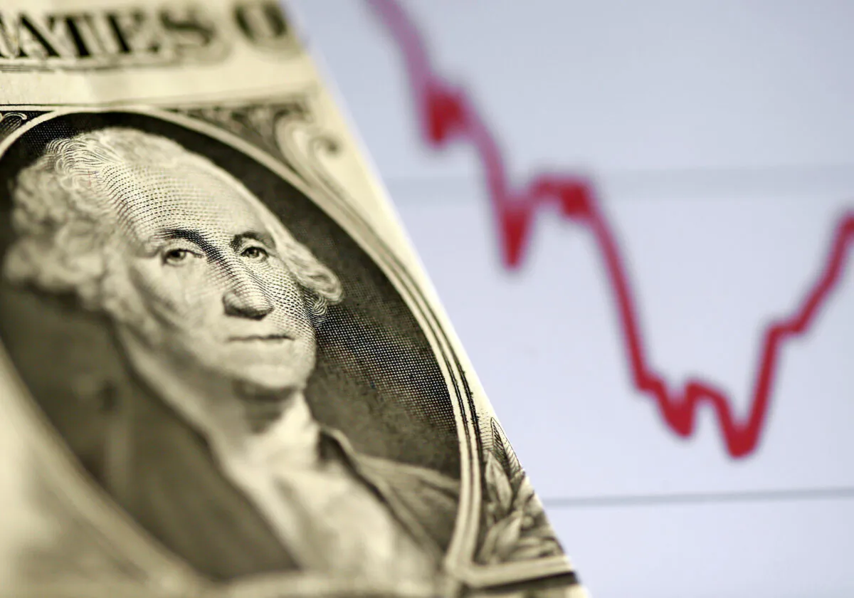 A U.S. dollar note in front of a stock graph in this picture illustration, on Nov. 7, 2016. (Dado Ruvic/Reuters)