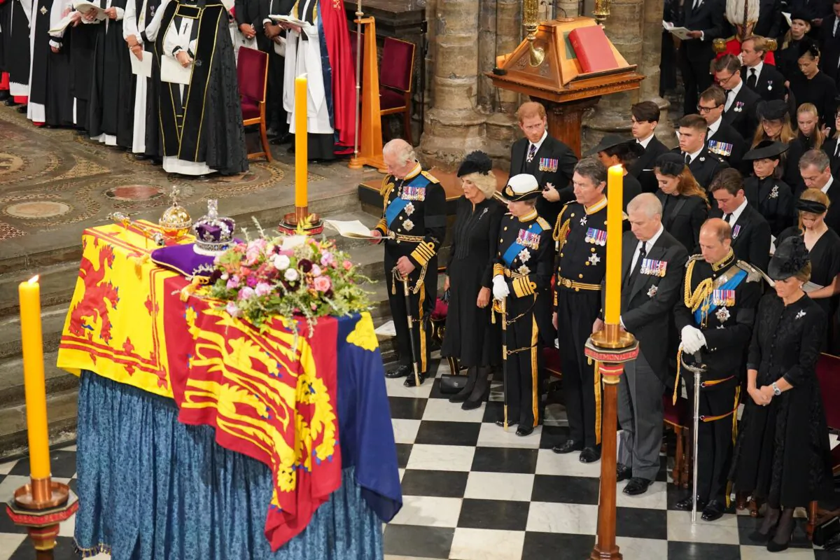 King Charles III, the Queen Consort, the Princess Royal, and other members of the royal family sit in front of the coffin of Queen Elizabeth II during her state funeral at the Westminster Abbey in London, on Sept. 19, 2022. (Dominic Lipinski/PA Media)