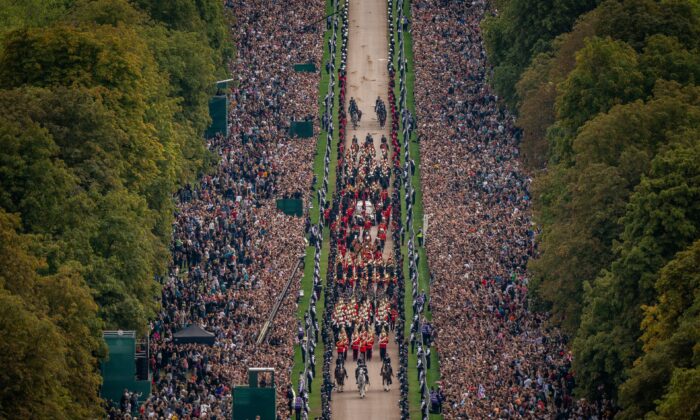 The Ceremonial Procession of the coffin of Queen Elizabeth II travels down the Long Walk as it arrives at Windsor Castle for the Committal Service at St. George's Chapel, United Kingdom, on Sept. 19, 2022. (Aaron Chown/PA Media)