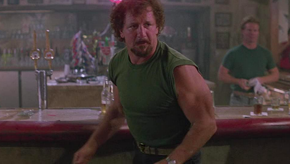 two men in green shirts in ROAD HOUSE 