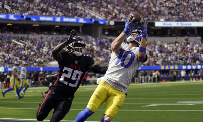 Los Angeles Rams wide receiver Cooper Kupp (10) makes a catch in the end zone for a touchdown during the first half of an NFL football game as Atlanta Falcons cornerback Casey Hayward (29) defends in Inglewood, Calif., on Sept. 18, 2022. (Mark J. Terrill/AP Photo)