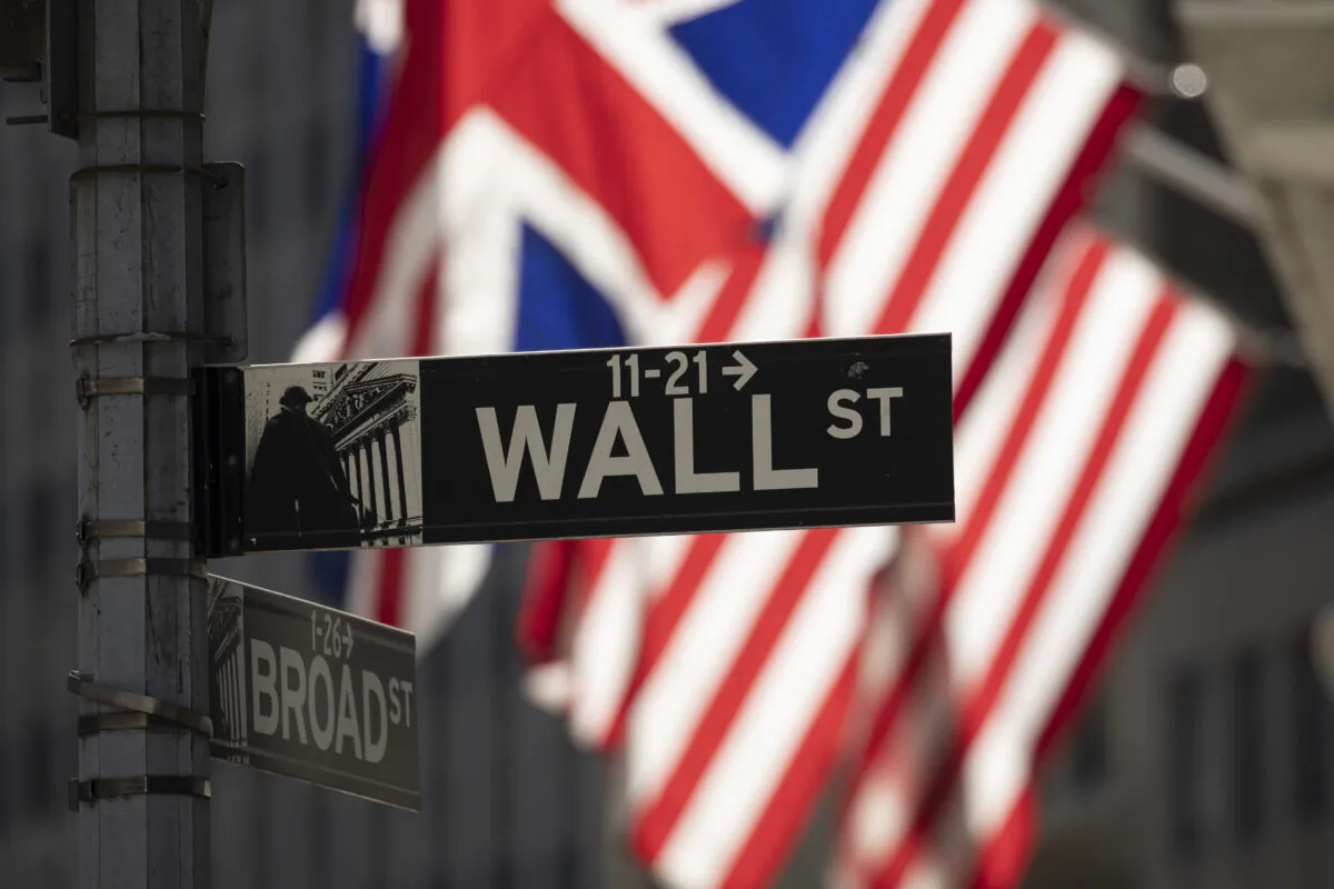 A Wall Street sign in front of the New York Stock Exchange on Sept. 16, 2022. (Yuki Iwamura/AP Photo)