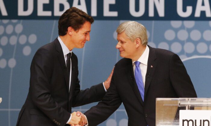 Then Conservative Leader Stephen Harper, right, and Liberal Leader Justin Trudeau shake hands following a debate in Toronto, on Sept. 28, 2015. (The Canadian Press/Mark Blinch)
