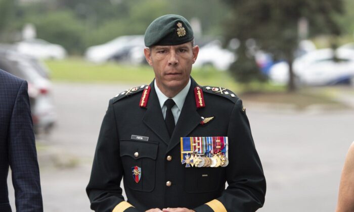 Major General Danny Fortin arrived and was processed at the Gatineau Police Station in Gatineau, Quebec on August 18, 2021.  (The Canadian Press/Justin Tang)