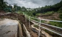 Typhoon Batters Western Japan With Record Rain, Killing 2