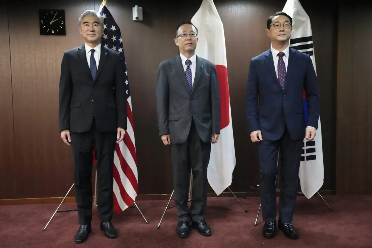 U.S. Special Representative for North Korea Sung Kim (L), Japan Director-General for Asian and Oceanian Affairs Bureau Takehiro Funakoshi (C), and South Korea Special Representative for Korean Peninsula Peace and Security Affairs Kim Gunn pose for photographers prior to hold trilateral meeting on North Korea at the Ministry of Foreign Affairs of Japan in Tokyo on Sept. 7, 2022. (Eugene Hoshiko/AP Photo)