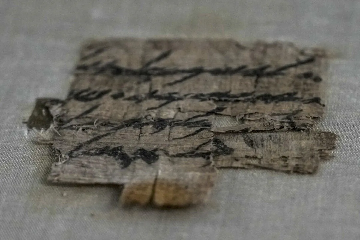 A scrap of papyrus at the Israeli Antiquities Authority, IAA, lab inside the Israel Museum in Jerusalem on Sept. 7, 2022. (Ariel Schalit/AP Photo)