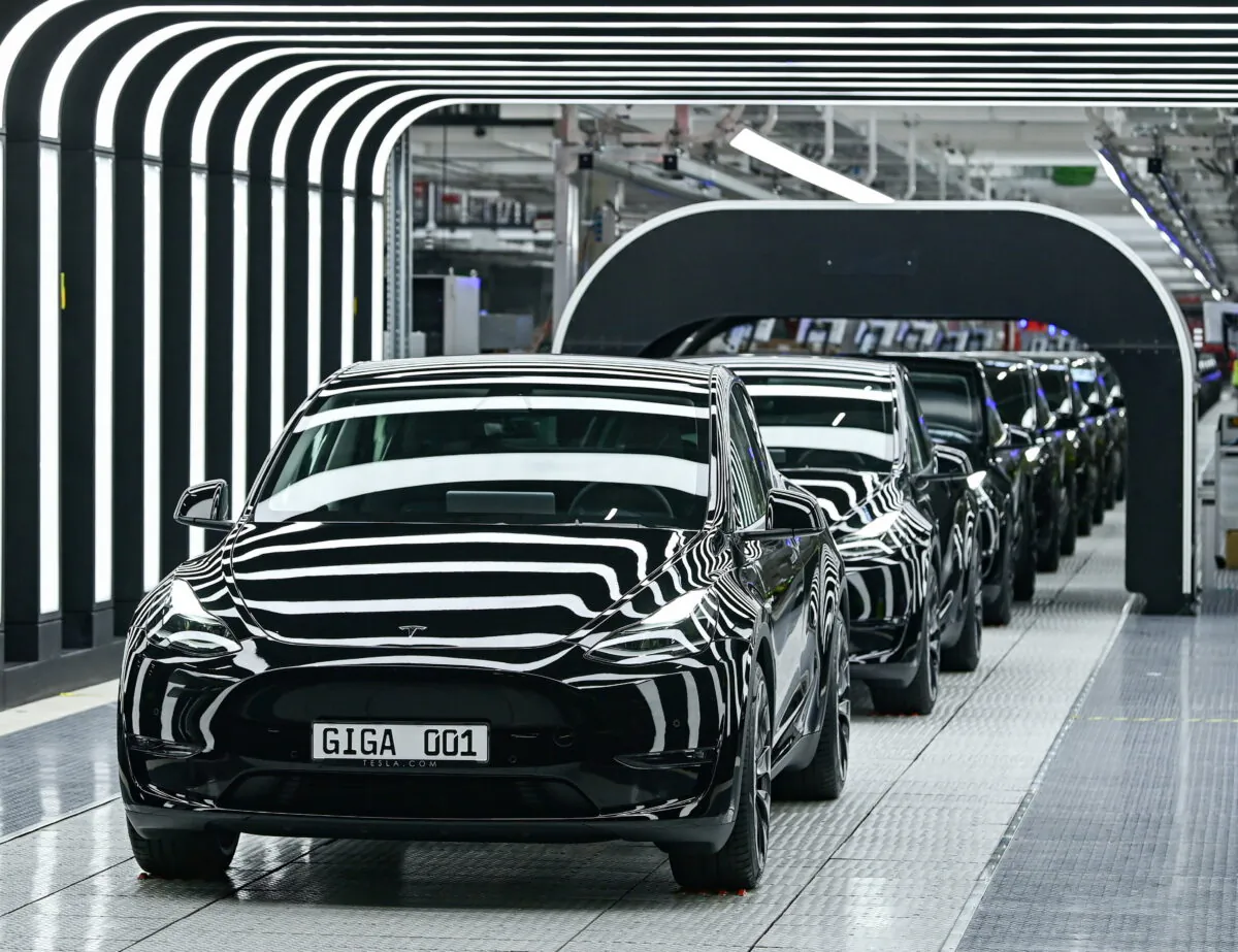 FILE PHOTO: Model Y cars are pictured during the opening ceremony of the new Tesla Gigafactory for electric cars in Gruenheide, Germany, March 22, 2022. Patrick Pleul/Pool via REUTERS