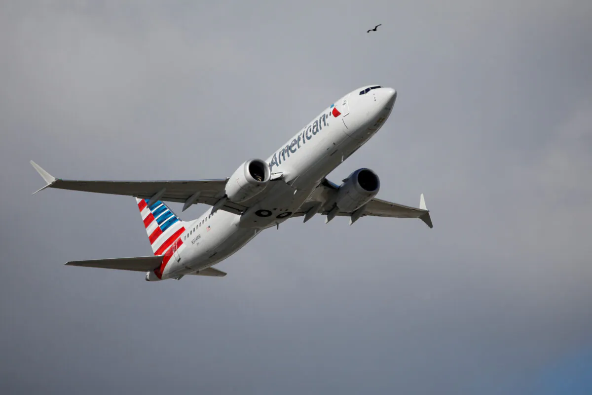 American Airlines flight 718, the first U.S. Boeing 737 MAX commercial flight since regulators lifted a 20-month grounding in November, takes off from Miami on Dec. 29, 2020. (Marco Bello/Reuters)